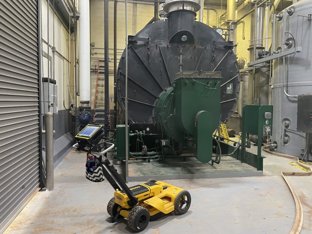 GPR Arkanas' GPR cart used to detect an underground water leak in a boiler room.