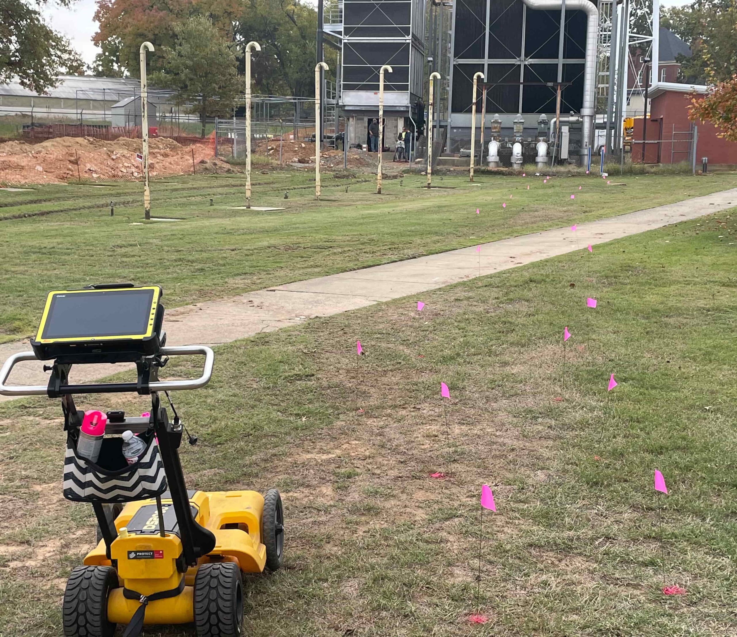 Yellow GPR cart marking underground lines